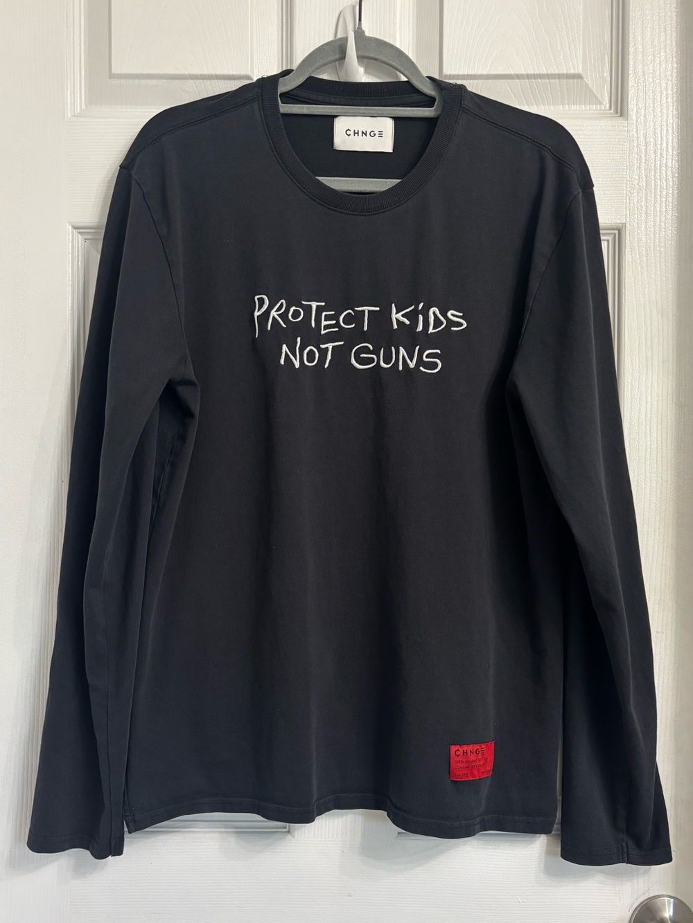 CHNGE Large Black Long Sleeve Tee with White 'Protect Kids Not Guns' Embroidery
